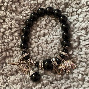 Women’s beaded bracelet with elephant, fairy charm